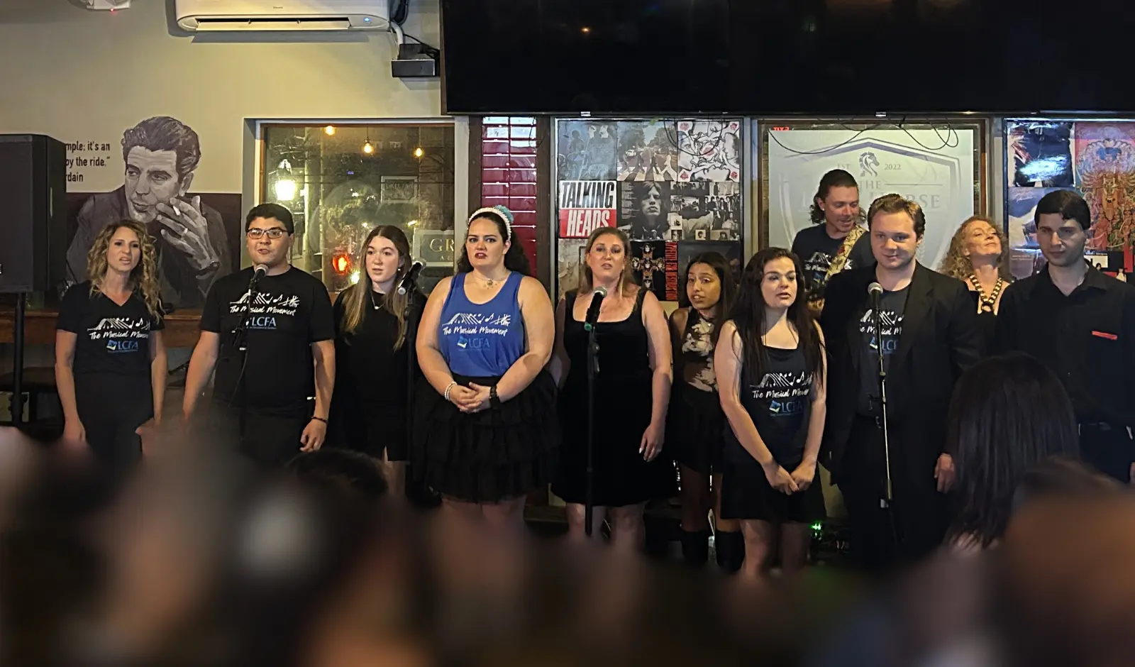 Group singing at the TMM fundraiser