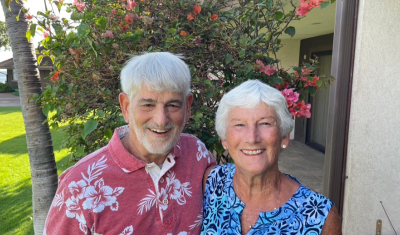 Larry and his wife smiling